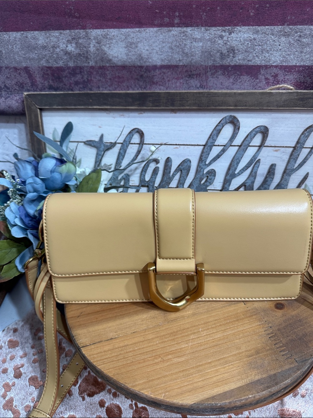Elegant Beige Leather Crossbody Bag with Gold Accent Charles and Keith